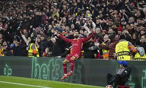 Liverpool's Mohamed Salah celebrates after scoring his side's first goal during the Champions League (AP)