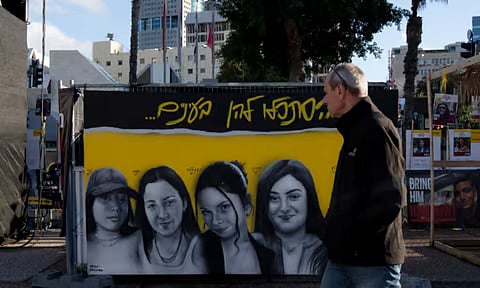 A mural of female Israeli soldiers held hostage by the Hamas militant group in the Gaza Strip is displayed in Tel Aviv