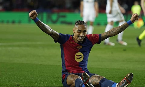 Barcelona's Raphinha celebrates after Fermin Lopez, not in the picture, scored his side's fifth goal during the Spanish La Liga soccer (AP)