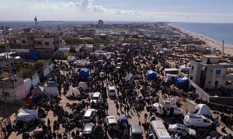 An aerial photograph taken by a drone shows displaced Palestinians
