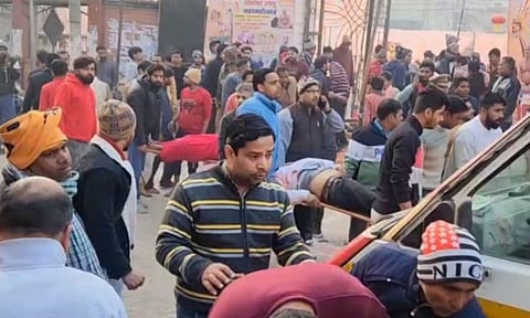 Injured devotees being taken for treatment after a watchtower collapsed during 'Laddu Mahotsav', at Baraut, in Baghpat (PTI)