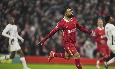 Liverpool's Mohamed Salah celebrates after scoring his side's first goal during the Champions League, opening phase soccer match (AP)