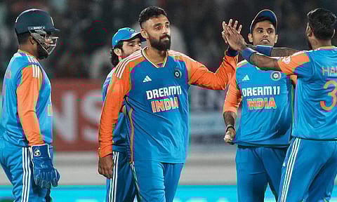 Varun Chakravarthy with teammates celebrates the wicket of England's Jofra Archer during the third T20 cricket match between India and England&nbsp;