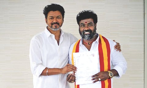 Vijay with one of the newly appointed district secretaries