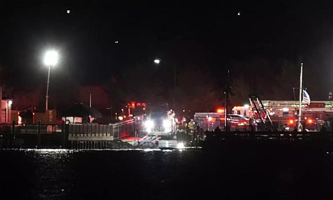 First responders gather Wednesday night at the site of a crash between a passenger jet and helicopter at Ronald Reagan Washington National Airport near Washington, D.C. (AP)