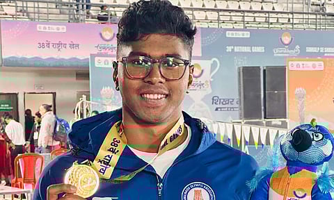 Benedicton Rohit poses with his gold medal