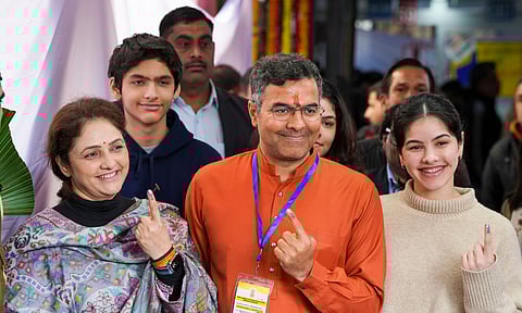 BJP candidate Parvesh Sahib Singh Verma arrives to cast his vote at a polling booth during the Delhi Assembly elections (PTI)