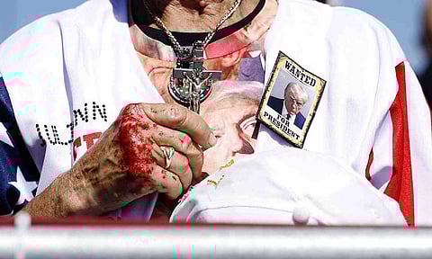 A woman holds a crucifix during a prayer at a rally for former U.S. President Donald Trump at the Aero Center Wilmington, North Carolina (file photo)