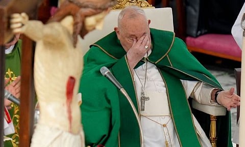 Pope Francis touches his eyes as he presides over a mass for the jubilee of the armed forces&nbsp;