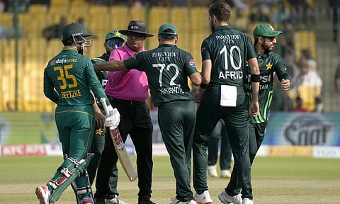 Umpire Asif Yaqoob talks with South Africa's Mathew Breetzke and Pakistan's Shaheen Shah Afridi, after they exchange words during the tri-series ODI cricket match between Pakistan and South Africa, in Karachi (AP)&nbsp;