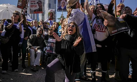 Israelis react at the so-called ‘Hostages Square’ as they watch a live Gaza broadcast of the release of three Israeli hostages