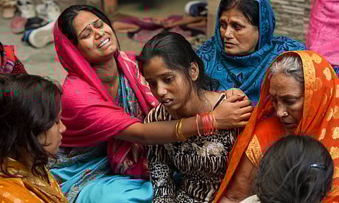 Relatives of 38-year-old Pinky Devi, who died in a stampede at the New Delhi Railway Station, mourn her death, at Sangam Vihar in New Delhi, Sunday, Feb. 16, 2025 (PTI)&nbsp;