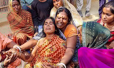 Family members of Neeraj Bhagdar, who died in a stampede that ocurred at the New Delhi railway station late Saturday night, mourn his death, at his native place in Vaishali district, Bihar (PTI)&nbsp;
