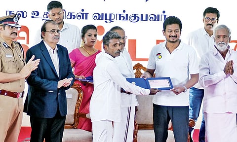 Deputy Chief Minister Udhayanidhi Stalin handing over financial aid to a former prisoner in Chennai on Tuesday