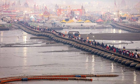 Prayagraj: Devotees walk on a pontoon bridge during the Maha Kumbh Mela 2025, at Sangam in Prayagraj (PTI)