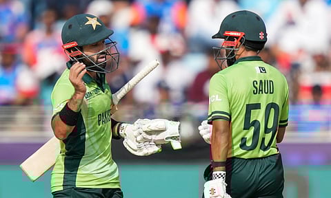 Saud Shakeel, right, celebrates his half century with captain Mohammad Rizwan during a One Day International (ODI) cricket match of the ICC Champions Trophy between India and Pakistan
