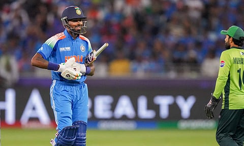 India's Hardik Pandya returns to pavilion after being dismissed by Pakistan's Shaheen Afridi during a One Day International (ODI) cricket match of the ICC Champions Trophy between India and Pakistan