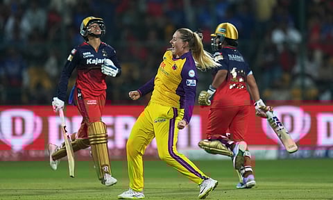 UP Warriorz players Sophie Ecclestone and Tahlia McGrath celebrate after the team won a Women's Premier League (WPL) 2025 cricket match against Royal Challengers Bengaluru (PTI)