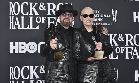 Inductees Dave Stewart, left, and Annie Lennox of Eurythmics pose in the press room during the Rock &amp; Roll Hall of Induction Ceremony (AP)