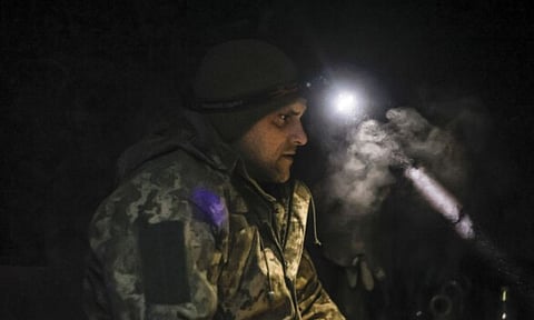 A Ukranian service man sits in a shelter (AP)