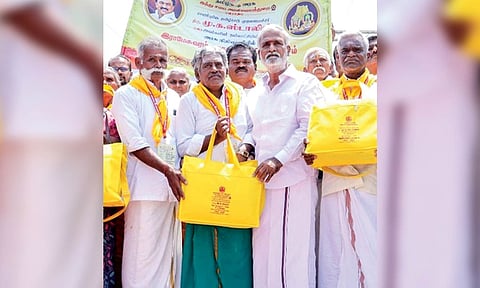 HR&amp;CE Minister PK Sekarbabu handing over travel kit to devotees taking a Rameswaram to Kashi trip, on Thursday
