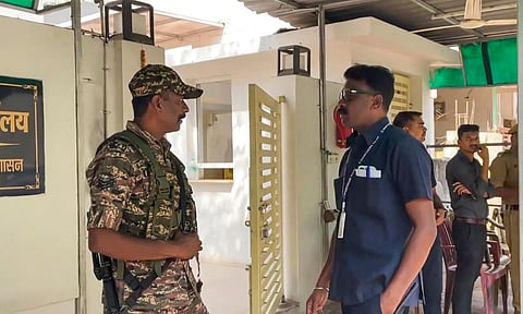 Security personnel stand guard during raids by the Enforcement Directorate (ED) on premises linked to Chaitanya Baghel, son of former Chhattisgarh Chief Minister and Congress leader Bhupesh Baghel, in connection with an alleged liquor scam, in Bhilai (PTI)