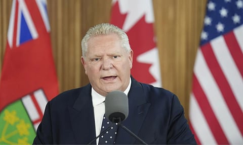 Ontario Premier Doug Ford holds a news conference regarding the new tariffs that the United States has placed on Canada, at Queen’s Park in Toronto on Tuesday (AP)