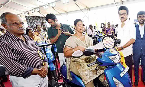 Chief Minister MK Stalin handing over a motorcycle to a differently-abled beneficiary at Chengalpattu on Tuesday