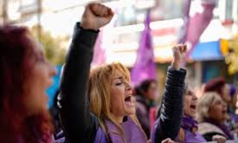 Women chant slogan during a protest in Istanbul (AP)