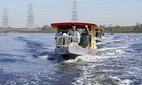 Delhi Minister Parvesh Sahib Singh Verma takes a boat ride during inspection of the cleanliness efforts at Yamuna ghats, in New Delhi, Wednesday, March 5, 2025 (PTI)&nbsp;