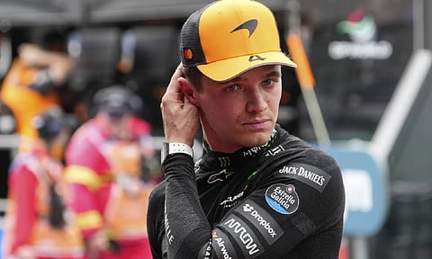 McLaren's Lando Norris reacts after taking pole in Australian Grand Prix (AP)