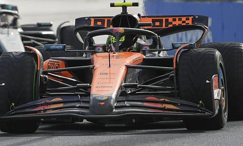 McLaren's Lando Norris waves to the crowd after winning the Australian Grand Prix (AP)