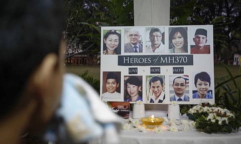 A Malaysian boy wipes his tears during a special prayer for the ill fated Malaysia Airlines Flight 370 at a church in Kuala Lumpur, Malaysia (AP)