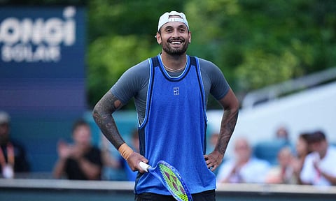 Nick Kyrgios celebrates after winning the match