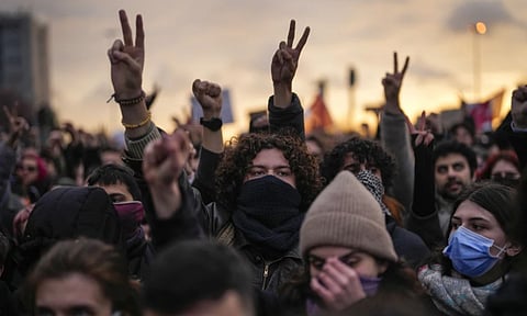People shout slogans as they march to protest against the arrest of Istanbul Mayor Ekrem Imamoglu, in Istanbul (AP)