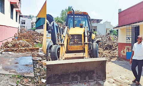 Field workers from the Corporation clean the piled-up garbage and overflowing sewage water at Balaji Avenue crematorium in Chitlapakkam on Monday
