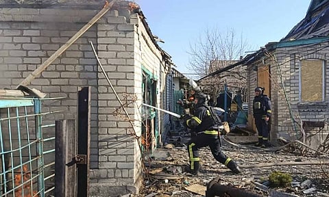 Ukrainian Emergency Service firefighters put out the fire following a Russian attack in Donetsk region, Ukraine (AP)