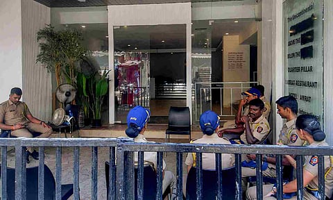 Police personnel outside the hotel where Shiv Sena (Shinde) workers allegedly vandalised the Habitat Studio of stand-up comedian Kunal Kamra (PTI)