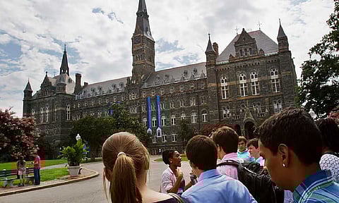 Prospective students tour Georgetown University's campus in Washington (AP)