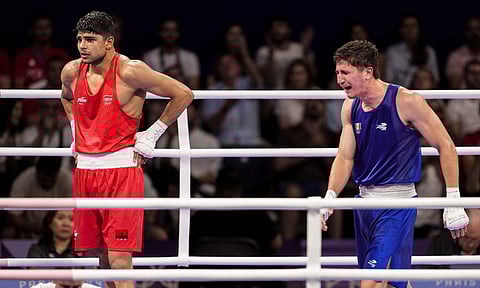 &nbsp;India's Nishant Dev (in red) looks on after lost against Alvarez Marco Verde of Maxico&nbsp;
