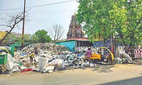 The garbage pile-up on a vacant site near the temple can lead to mosquito and rodent menace