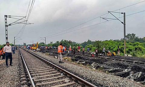 Railway officials and workers during the repair and restoration of a railway track, a day after eleven coaches of the SMVT Bengaluru-Kamakhya AC Express derailed at Nirgundi near Manguli (PTI)