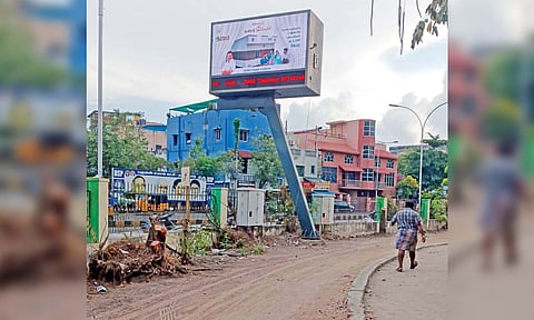 &nbsp;Stumps of the trees left behind at the Murasoli Maran park beside the digital board in Perambu