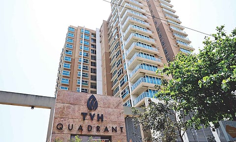 Raid was conducted on the premises of TVH Quadrant, a firm founded by KN Ravichandran; (inset) ED officials at the scene (Photo: Justin George)