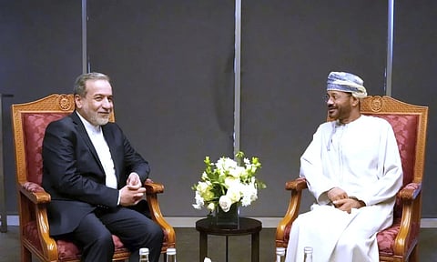 In this photo released by Iranian Foreign Ministry, Iranian Foreign Minister Abbas Araghchi, left, meets his Omani counterpart Sayyid Badr Albusaidi prior to negotiations with U.S. Mideast envoy Steve Witkoff (AP)