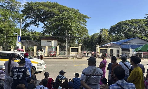 Family members and colleagues wait to welcome released prisoners outside the main gate of Insein prison during the Country's Traditional New Year day on Thursday in Yangon, Myanmar(AP)