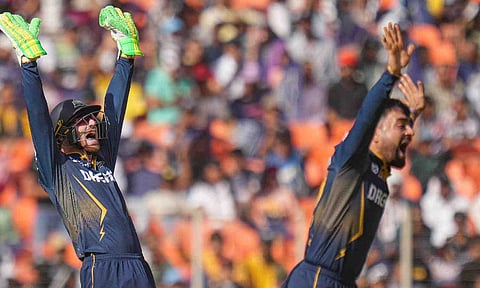 Gujarat Titans' bowler Rashid Khan and wicket-keeper Jos Buttler during the match (PTI)