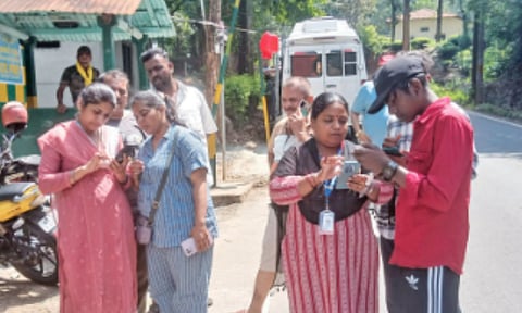 Tourists being helped to register for e-pass at Mel Gudalur&nbsp;
