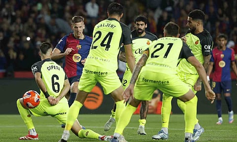 Dani Olmo shoots to score against Mallorca
