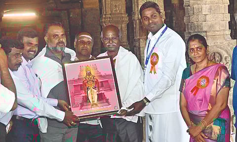 Portrait of Raja Raja Cholan II being handed over to researchers at Darasuram temple in Kumbakonam on Friday